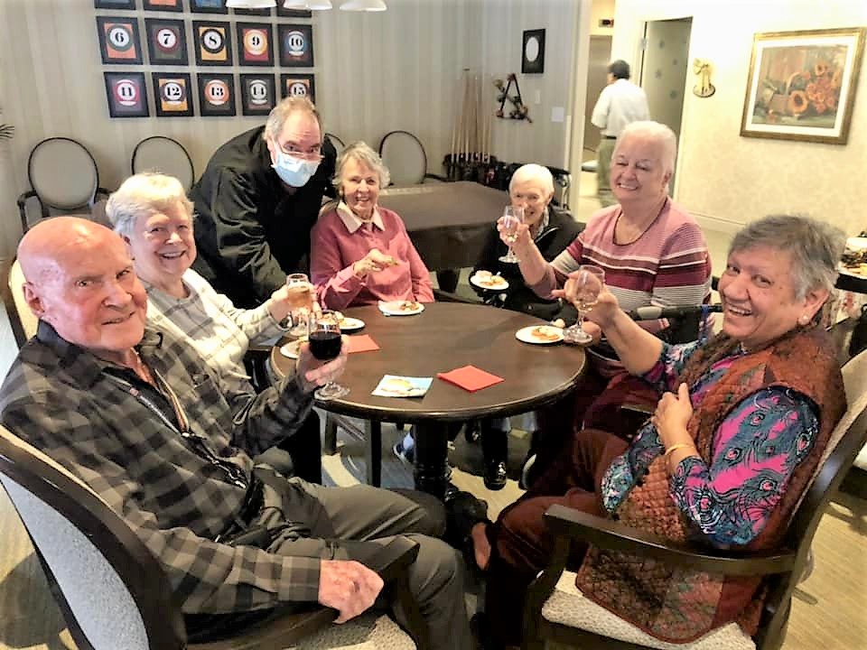 Group of seniors socializing at a table