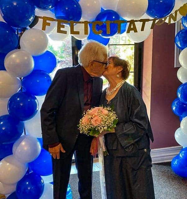 Love is in the Air - All Seniors Care Senior couple kissing at their wedding.