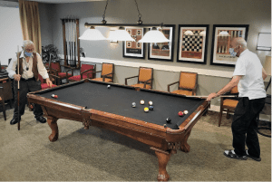 Residents playing pool