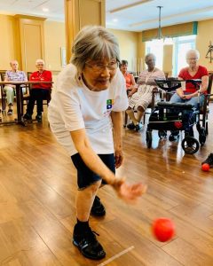 Asian senior playing bocce